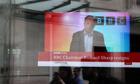 A screen inside BBC headquarters broadcasts a statement by Richard Sharp following his resignation in April.