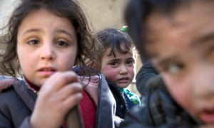 Syrian children flee their homes in the town of Beit Sawa in Syria’s besieged eastern Ghouta region.