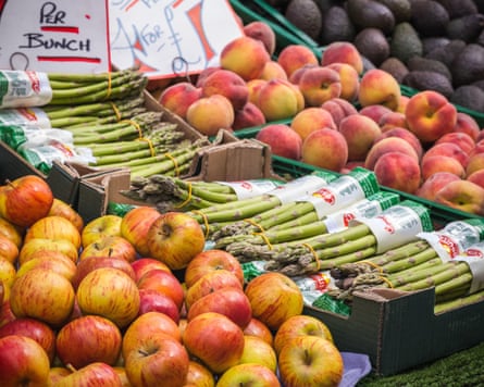 A variety of fruits on display at a fruit stall of Brick Lane market, London, England3BANB9H A variety of fruits on display at a fruit stall of Brick Lane market, London, England