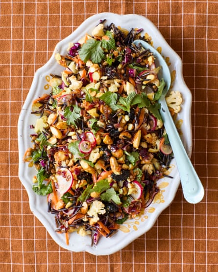 Wild rice and cauliflower salad with carrots, nuts, radishes and herbs.