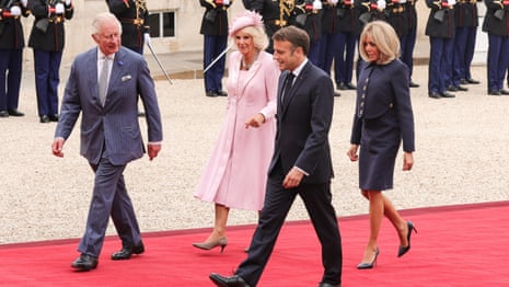 King Charles and Queen Camilla enter French presidential palace with President Macron – video