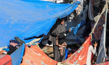 Woman in makeshift shelter