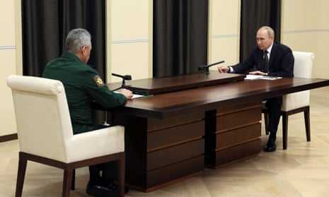 Vladimir Putin hears Russia’s defence minister Sergei Shoigu report in a televised meeting on Friday that ‘The task of recruiting 300,000 people has been completed.’