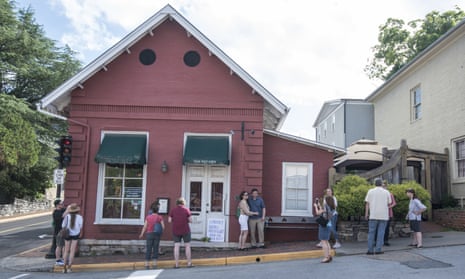 People gather in front of the Red Hen in Lexington, Virginia. The restaurant has become internationally famous since ousting Sarah Sanders over the weekend.