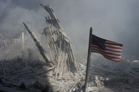 An American flag flies near the base of the destroyed World Trade Center