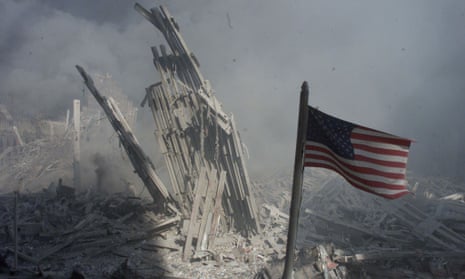 An American flag flies near the base of the destroyed World Trade Center in New York on 11 September 2001.