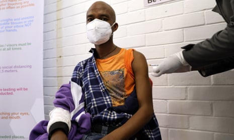 A volunteer in South Africa is injected during the clinical trial for a potential vaccine against Covid-19 in Soweto.