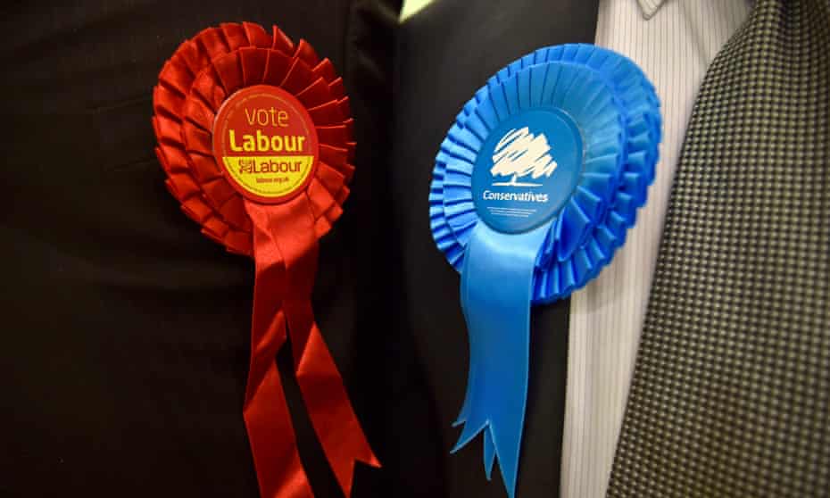 Conservative and Labour rosettes