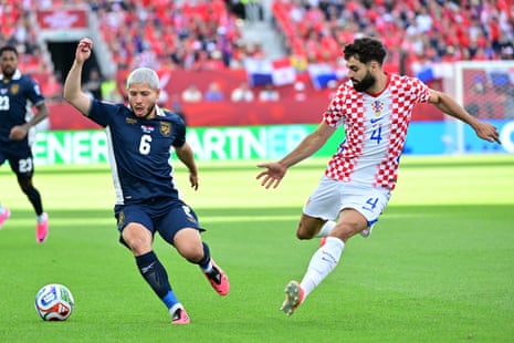 Josko Gvardiol clears the ball from Cristian Martinez.