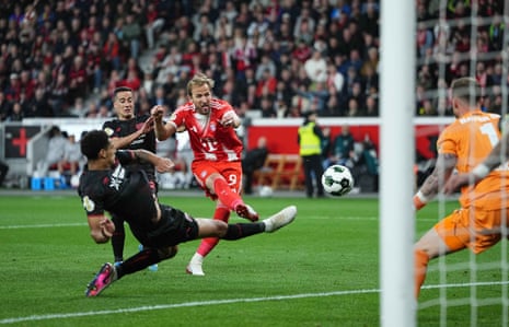 Harry Kane scores for Bayern against Leverkusen.