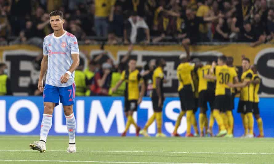 Cristiano Ronaldo looks dejected as Young Boys celebrate scoring against Manchester United