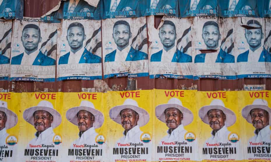 Posters of President Yoweri Museveni and Robert Kyagulanyi, aka Bobi Wine, on a street in Kampala, Uganda.