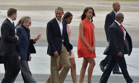 Barack Obama shares a joke with Raúl Castro as he walks to board his plane at José Martí international airport in Havana.