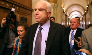 John McCain leaves the Senate Chamber after rejecting the GOP “Skinny Repeal” health bill.