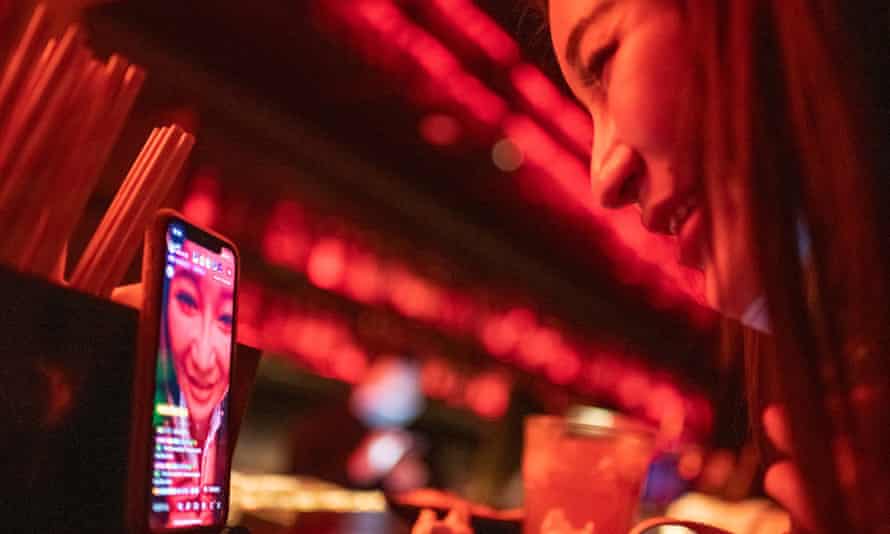 Singer and blogger Yuan Qinggai livestreams from the bar at 44KW nightclub in Shanghai