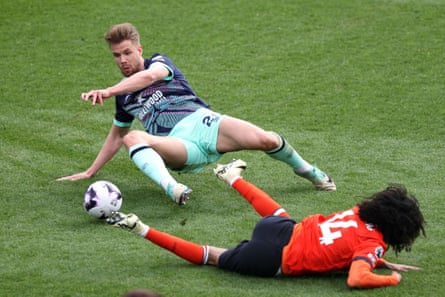 20 April 2024Kristoffer Ajer of Brentford tackles Tahith Chong of Luton during their match at Kenilworth Road. Brentford won 5-1.