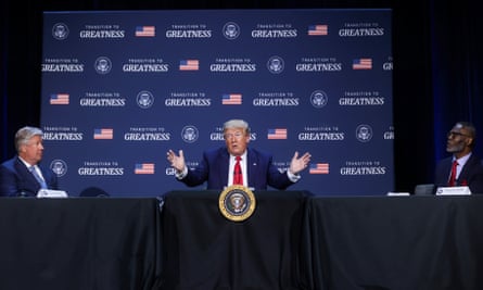 Donald Trump is flanked by Pastor Robert Morris, left, and the Gateway church bishop Harry Jackson during a roundtable discussion in Dallas, Texas, on 11 June 2020.