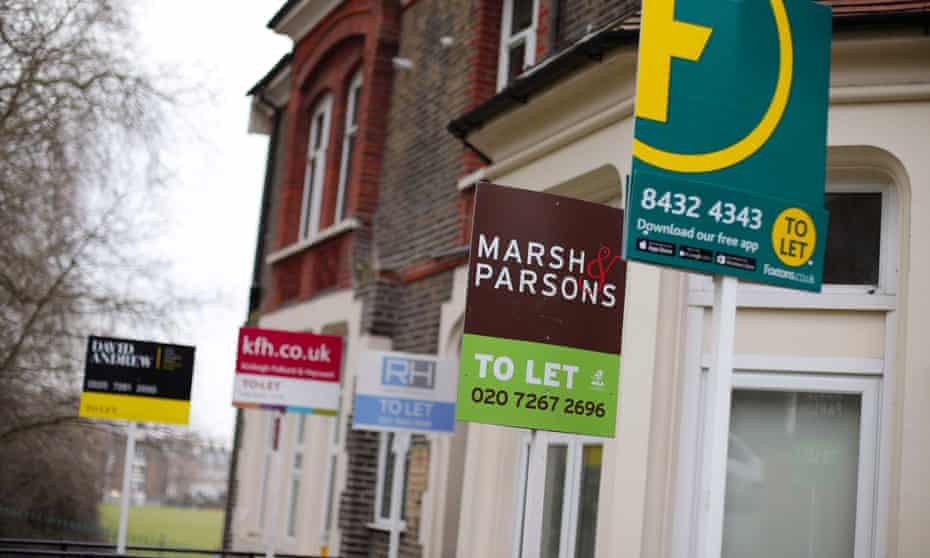 A row of To Let estate agent signs placed outside houses in north London. 