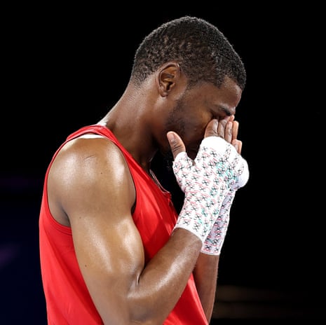 Namibia’s Tryagain Morning Ndevelo reacts following his default victory over Anthony Joseph of Trinidad & Tobago.