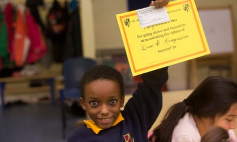 A child  holding a certificate
