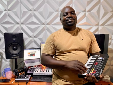 Producer Emmanuel Oduor, known as LakeMan, holding a mini-keyboard.
