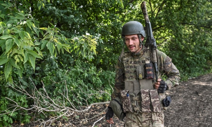 A Ukrainian serviceman walks at a position near a frontline near a frontline in Zaporizhzhia, Ukraine, on July.