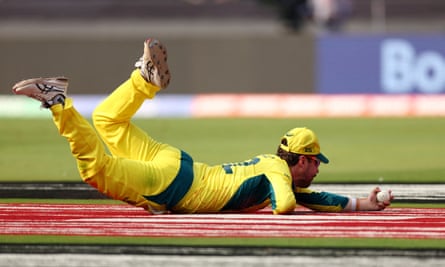 Travis Head takes the catch to dismiss Rohit Sharma.
