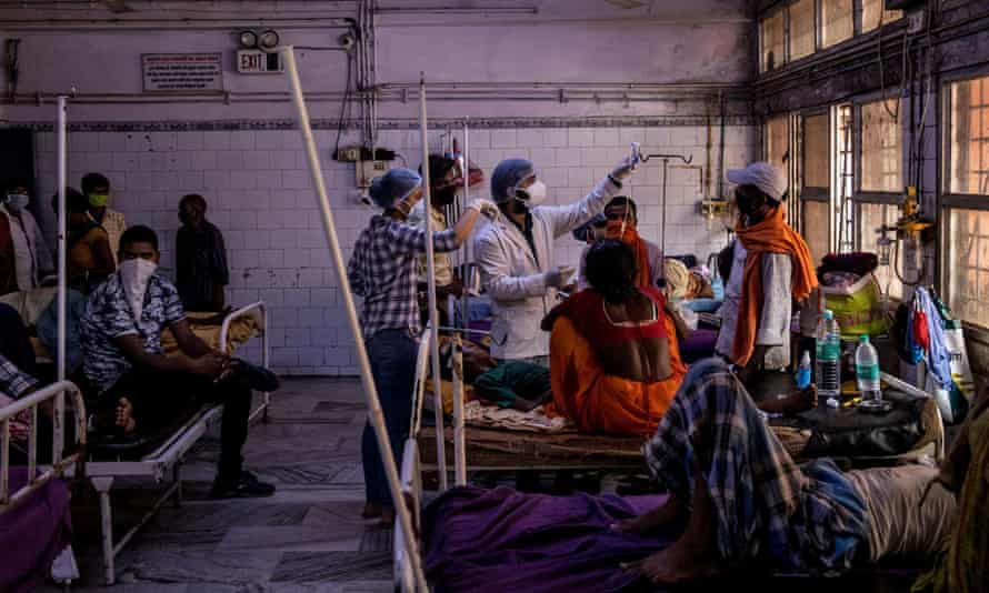 Medical staff treat a patient inside the emergency ward of Jawahar Lal Nehru medical college and hospital, during the coronavirus outbreak, in Bhagalpur, Bihar.