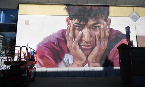 A large portrait of Sanda Dia adorns the wall of a lecture hall in Leuven, Belgium