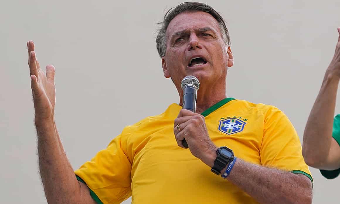Jair Bolsonaro speaks into a microphone