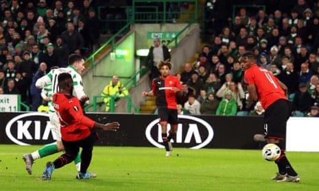 Celtic’s Lewis Morgan (left) scores his side’s first goal of the game.