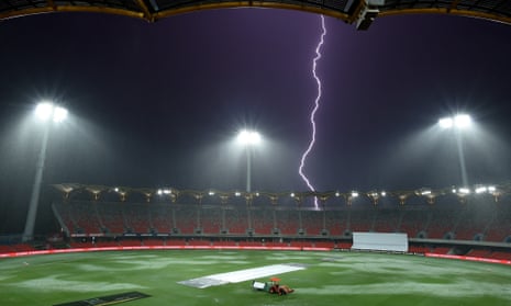 Lightning is seen during a rain delay on day two of the Women's International Test match between Australia and India.