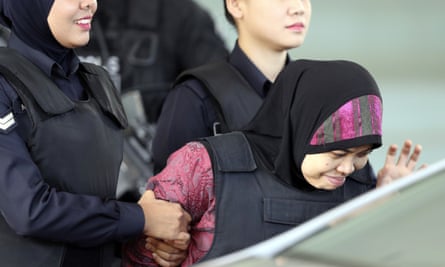 Siti Aisyah (right) leaves court in Malaysia