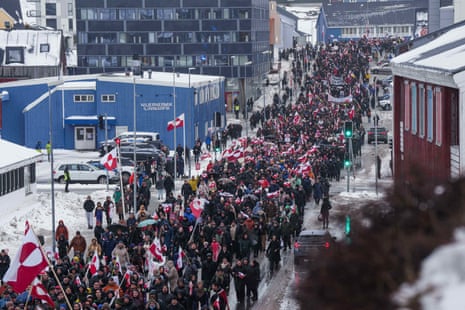A crowd walks to the US consulate to protest against Trump's policy in Nuuk, Greenland.