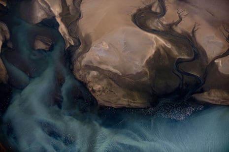 An aerial shot shows flamingos at Walvis Bay lagoon in Namibia.