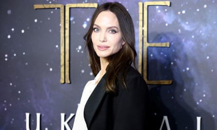 Angelina Jolie poses as she arrives for a screening of the film Eternals.