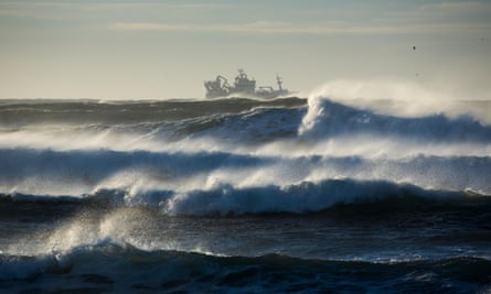Waves breaking around a trawler off the Reykjanes Peninsula, Iceland