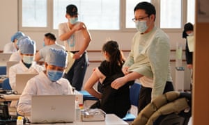 People receive Covid vaccines at a healthcare center in Honglian Community in Xicheng District of Beijing, capital of China, 3 January 2021.