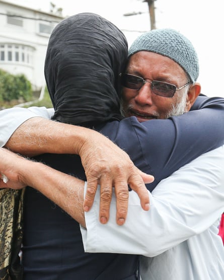 Jacinda Ardern comforts a mourner at Kilbirnie mosque in Wellington