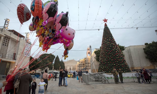 Christmas in Bethlehem: a Palestinian man sells balloons in Manger Square.