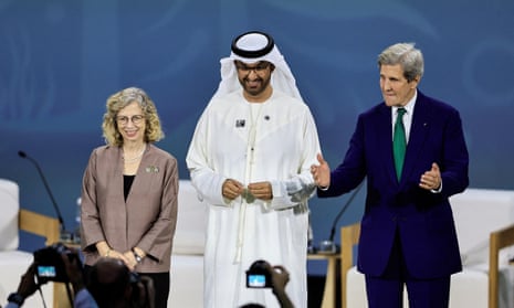 Sultan Al Jaber, flanked by Unep’s executive director, Inger Andersen, and US climate envoy John Kerry, at Cop28