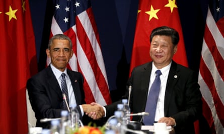 Xi Jinping shakes hands with Barack Obama during their meeting at the start of the climate summit in Paris on 30 November 2015.