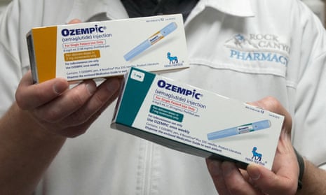 A US pharmacist holds boxes of Ozempic