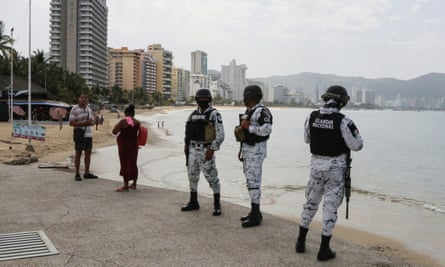 Members of Mexico’s national guard keep watch on 2 July during the reopening of the beaches and hotels in Acapulco.