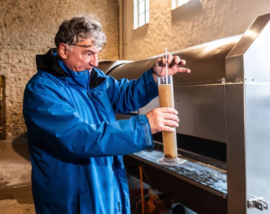 Vintner Ralf Petgen measures the Oechsle or sugar content of his eiswein.