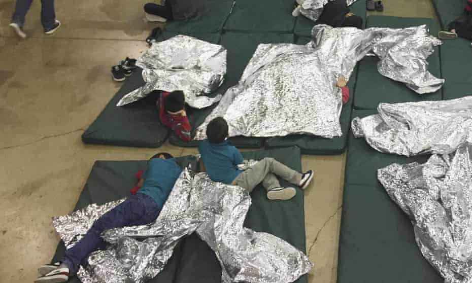 Child migrants rest in one of the cages at a facility in McAllen, Texas, in this 17 June photograph provided by Immigration and Customs Enforcement.