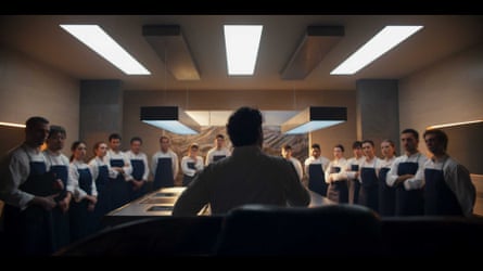 Fernández speaking to a row of chefs who are watching him
