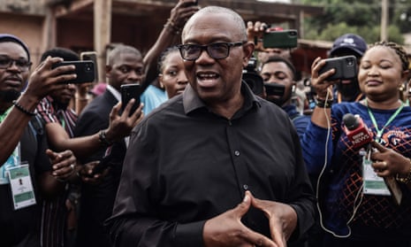 Peter Obi talks to the media outside a polling station in Amatutu on 25 February