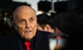 Rudy Giuliani in black suit with red tie