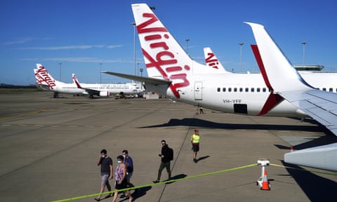 Passengers prepare to board a Virgin Australia flight bound for Darwin at Brisbane airport.